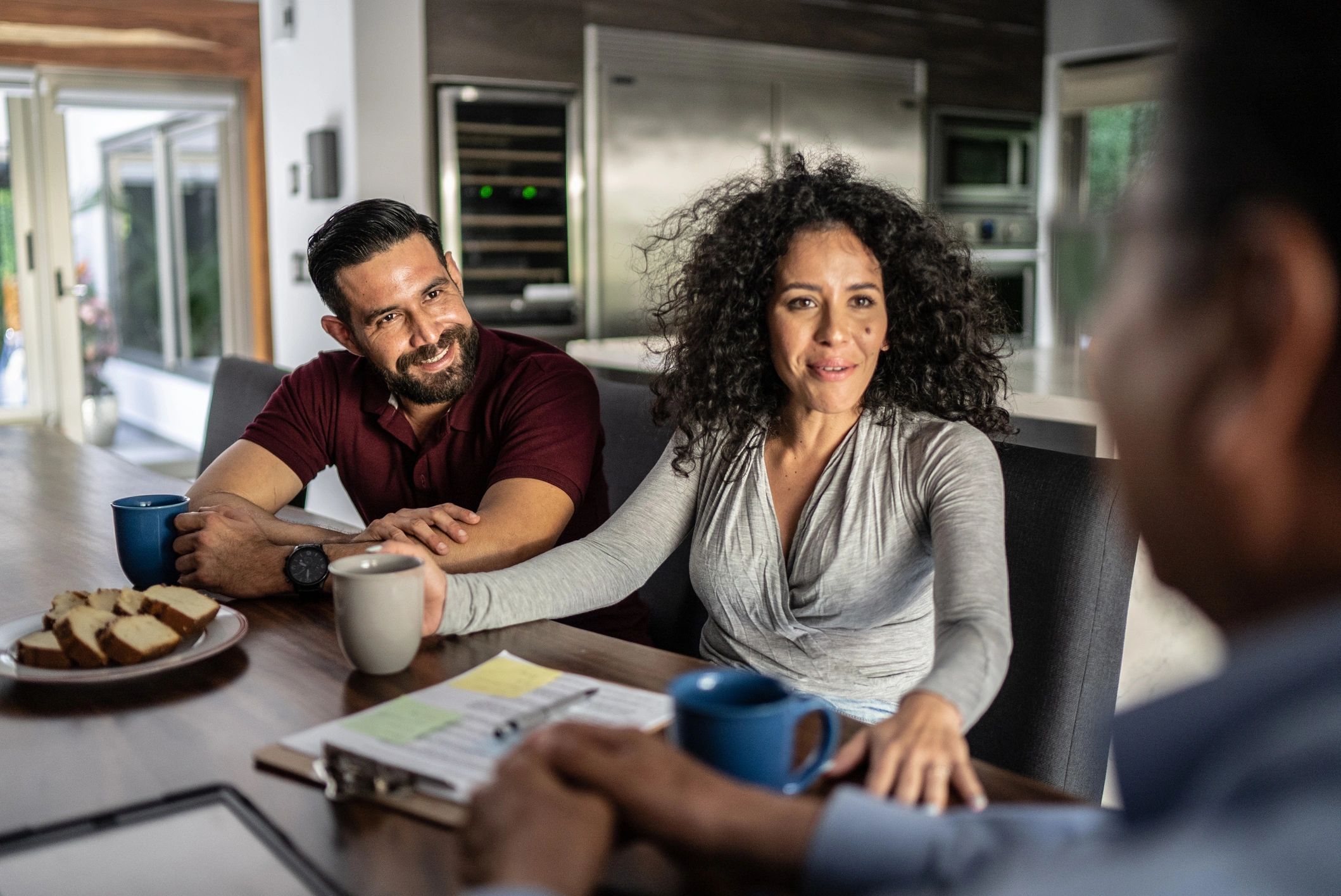 Prospective buyers meeting with a real estate advisor