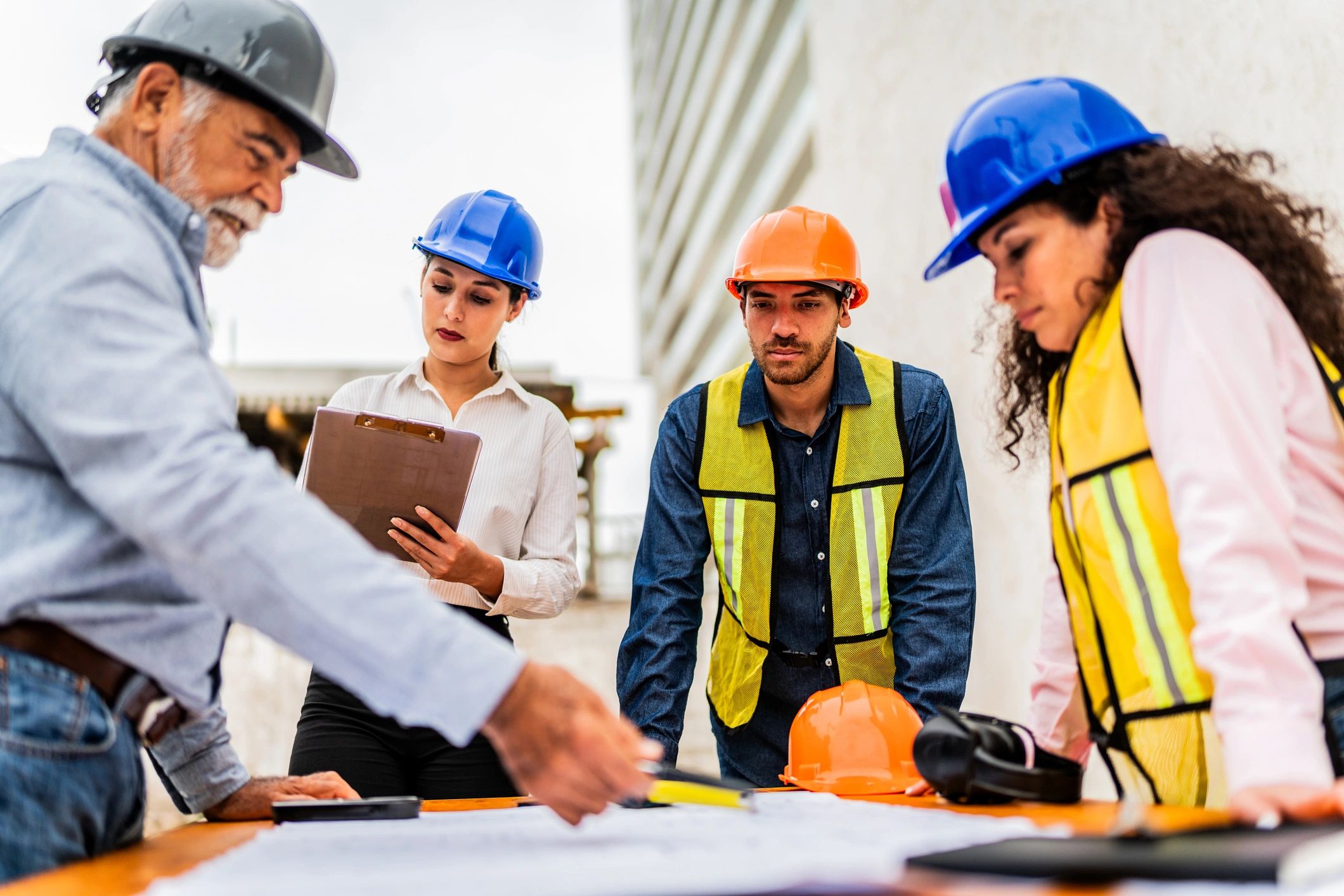 Construction team reviewing plans for a residential project