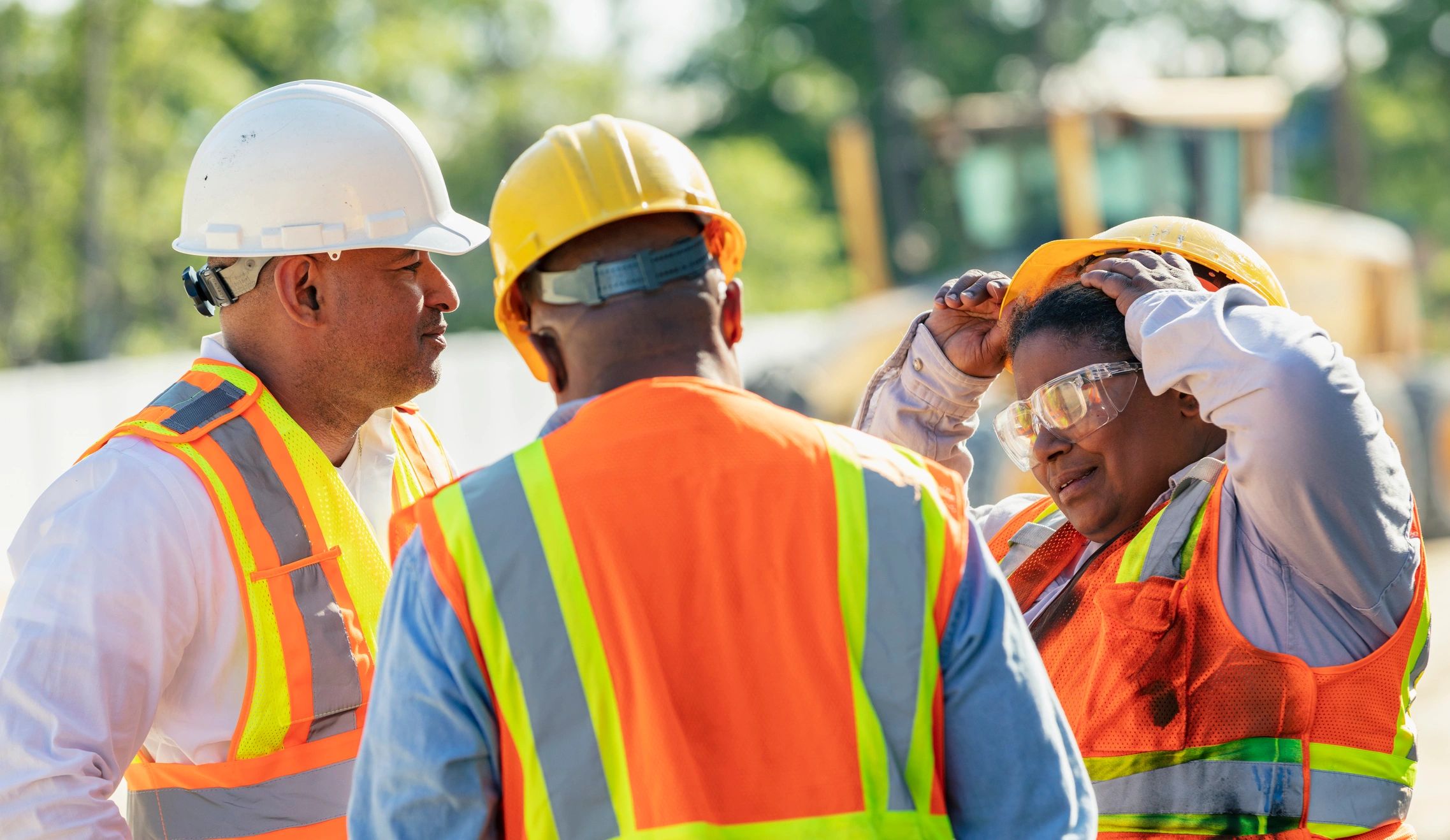 Construction professionals at a building site representing trusted execution